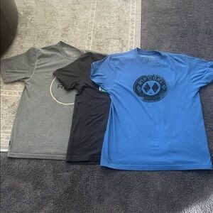 Bundle of two Men’s RVCA and one Medium Rip Curl short sleeve t-shirts.